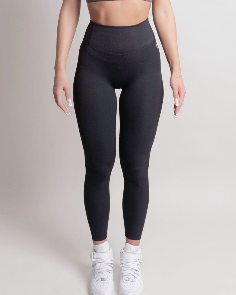 Woman wearing NOIR sport top and leggings front view by ZANOS Apparel
