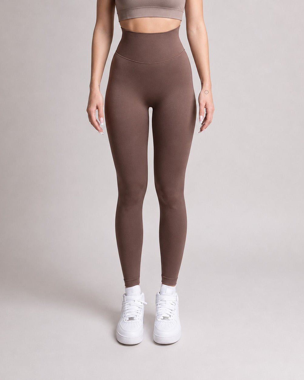 Woman wearing black NOIR Sculpt leggings by ZANOS Apparel