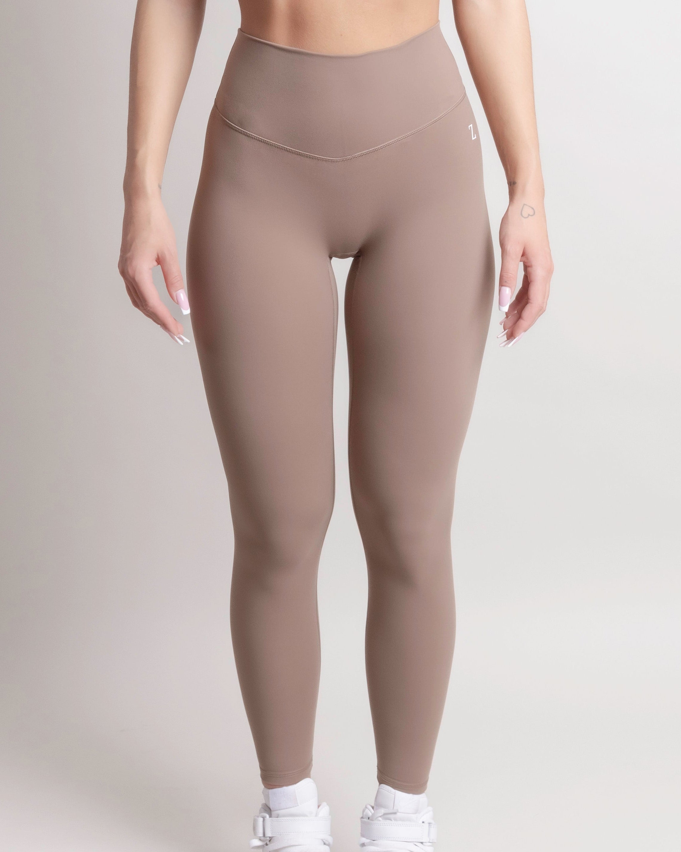Woman wearing black NOIR Sculpt leggings by ZANOS Apparel